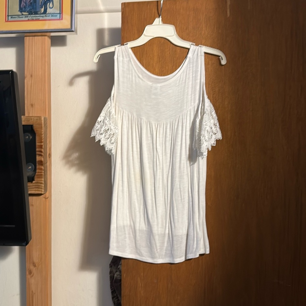 White ruffle top off the shoulder